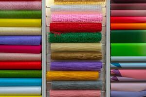 Multicolored rolls of wrapping paper on the showcase. Abstract background. photo