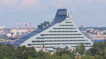 Riga, Latvia. Aerial View Of National Library Building, Named Castle of Light Or Gaismas Pils. Famous Landmark On Daugava Left Bank, Summer Green Landscape With Skyline Background video