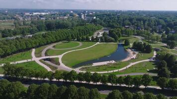 New redesigned Victory park in Riga, Latvia with a pond and pedestrian walks. Aerial view of the park near Riga center. video