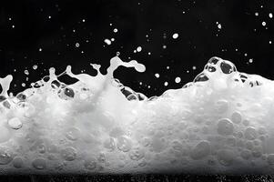 Clear macro image of water drops on black background, with hints of blue, representing fluidity and motion photo