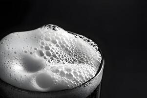 Clear macro image of water drops on black background, with hints of blue, representing fluidity and motion photo