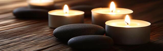 Tranquil zen setting with candles and smooth stones at dusk photo