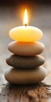 Peaceful zen arrangement with candles and stacked stones indoors photo