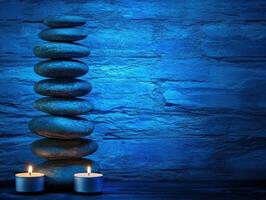 Tranquil zen background with stacked stones and illuminated candles photo
