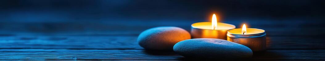 Illuminated candles and smooth rocks create a serene Zen atmosphere photo