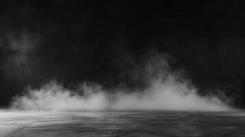 Low-lying fog on a darkened concrete floor at night photo