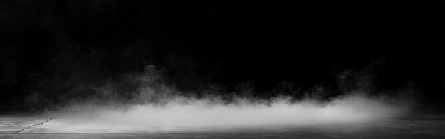 Mist forming on a dark surface in a low-lit environment photo