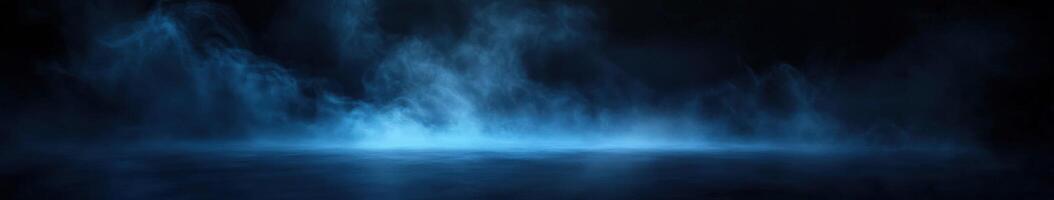 Misty blue landscape at night with fog over calm water surface photo