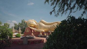 Vientiane, Laos - November 14, 2023 - Reclining Buddha in Wat That Luang Tai, Temple in Pha That Luang Area video
