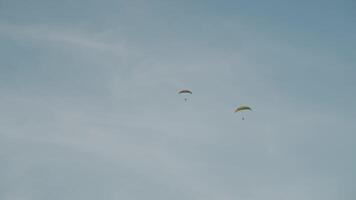 A powered parachute at Vang Vieng, Laos during sunset with a backdrop of karst mountains video