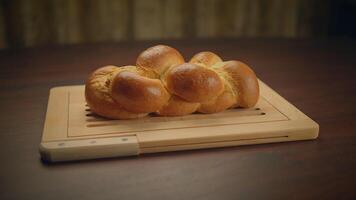 Freshly Baked Braided Bread on a Wooden Cutting Board, creating an appetizing and artisanal image video