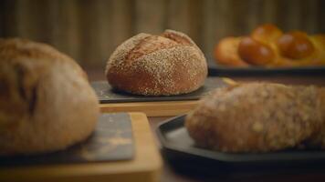 Artisan Bread Assortment displayed on a Rustic Wooden Table for an attractive presentation video