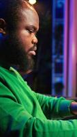 Vertical Sound engineer playing piano and mixing tunes on digital software, composing new songs and adding audio effects in post production. Artist composer creating soundtracks for music industry. Camera B. video