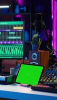Vertical Artist producer creating new music with mix and master techniques, using a screen with copy space layout. Skilled audio engineer editing tracks in post production, digital audio software. Camera A. video