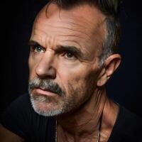 Close-Up of Mature Man With Intense Expression and Short Beard photo