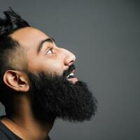 Muslim Man Smiling With a Big Beard in Studio Setting photo