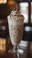 Delicious ice cream drink topped with whipped cream and chocolate chips photo