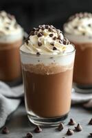 Delicious ice cream drink topped with whipped cream and chocolate chips photo
