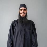 Smiling Bearded Muslim Man in Traditional Attire Indoors photo