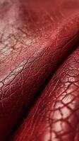 Close-Up View of Textured Red Leather Material With Natural Patterns photo
