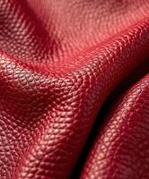 Red Leather Material Close-Up Captured in Soft Natural Light photo