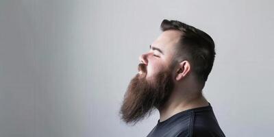 Muslim Man With a Beautiful Beard Posing Against a Neutral Background photo