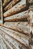 Rustic Wooden Wall With Textured Logs in a Cozy Cabin Atmosphere photo