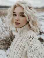Young Woman in Cozy Sweater Posing Outdoors During Winter Afternoon photo