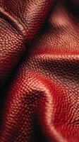Close-Up of Textured Red Leather Fabric Under Natural Light photo