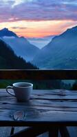 Serene Morning View of Mountains With Coffee Cup at Sunrise photo