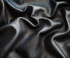 Textured Black Leather Material Draped on Surface photo