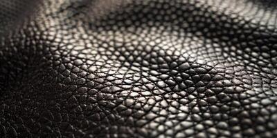 Close-Up of Textured Black Leather Material in Natural Light photo