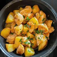 Pan-Seared Chicken and Potato Dish With Fresh Herbs in Kitchen Setting photo