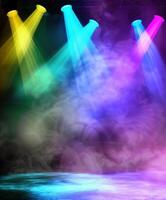 Colorful Spotlights Illuminate Empty Stage With Smoke Effects photo