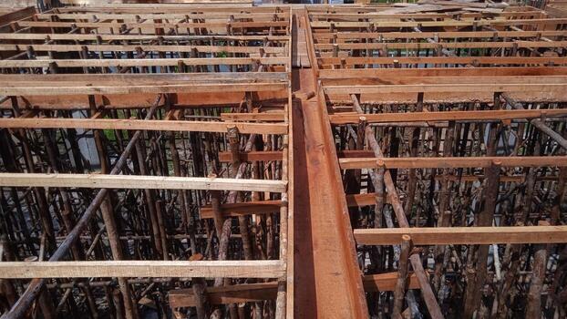 Wooden frame supporting the beam structure under construction. photo