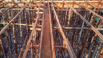 Wooden frame supporting the beam structure under construction. photo