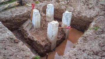 Concrete piles for building foundation photo