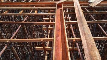 Wooden frame supporting the beam structure under construction. photo