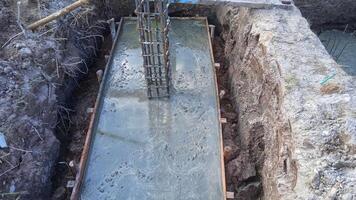 Foundation construction building site making reinforcement metal framework for pouring concrete photo