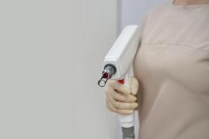 A beauty clinic with a white laser machine. A specialist offers hair removal and facial treatments using advanced diode technology for health and skincare photo