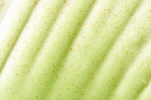 Cosmetic product background. Green scrub texture. Cleansing face emultion. Gel liquid peeling. Closeup pore cream. Abstract makeup lotion swatch. Beauty spa photo