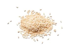 A top view of raw brown and white rice, forming a heap. The integral, uncooked grains highlight diverse Asian cuisine in this isolated pile. photo