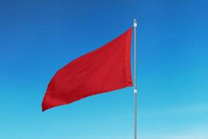 Red flag, symbolizing a stark warning that danger lurks beneath the surface. Used to alert people to extreme hazards and ensure safety at beaches or swimming areas photo