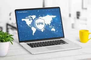 VPN web page service on laptop display displaying a world map with VPN locations. Highlights global network access, online security, and privacy protection photo