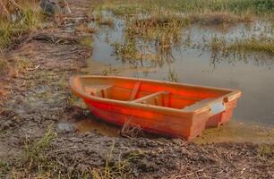 The picturesque small boats, with their lush paddy fields surrounding them and scenic landscape, have become a popular attraction for tourists at Sekinchan Malaysia. photo