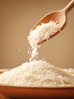 Pouring White Rice from Wooden Spoon - Food Photography Image photo