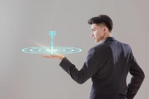 Targeting business concept. Businessman hold virtual target icons for business objective. Strategic planning for business growth and target customer group. set up business objective target goal photo