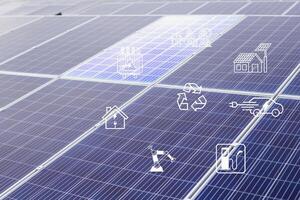 Solar cells have various symbols such as electric car charging station, robot, inverter, energy saving industry above the solar panels. photo
