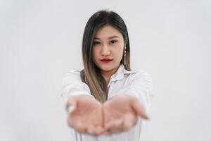 Empty thing in young Asian woman s two hands are raised up in front of camera for any presenting products or wording advertisements. photo