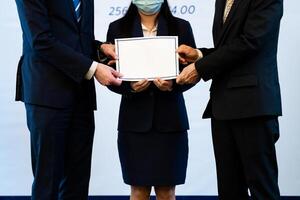 Photograph of the atmosphere during the ceremony of awarding an institution's certificate to trainees who have passed the test. photo